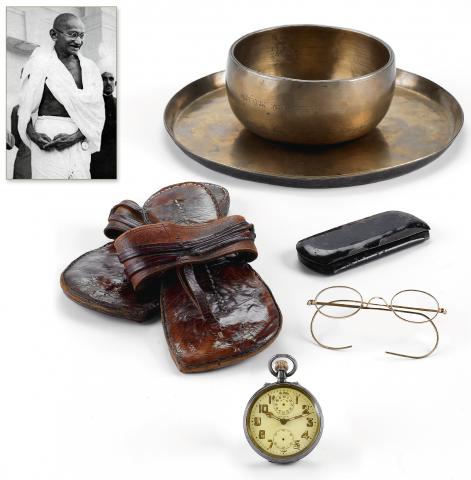 Antiquourm Lot #364 in the March 4-5 Auction: Zenith Alarm Pocketwatch, Eyeglasses, and Sandals described as having been owned by Mohandas Gandhi.  Photo: Antiquorum.
